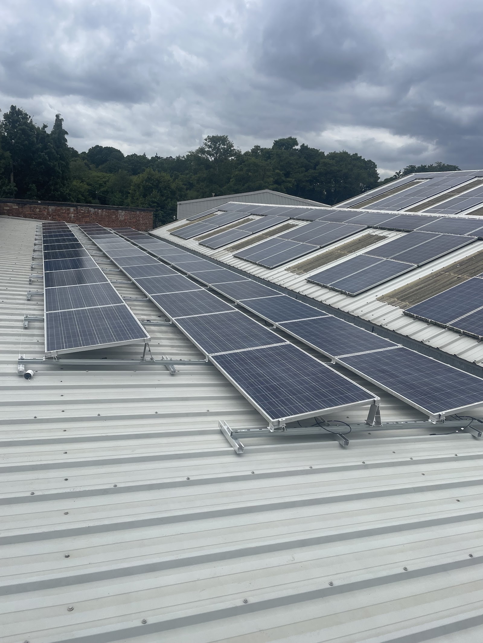 Rows of solar panels on a long commercial roof