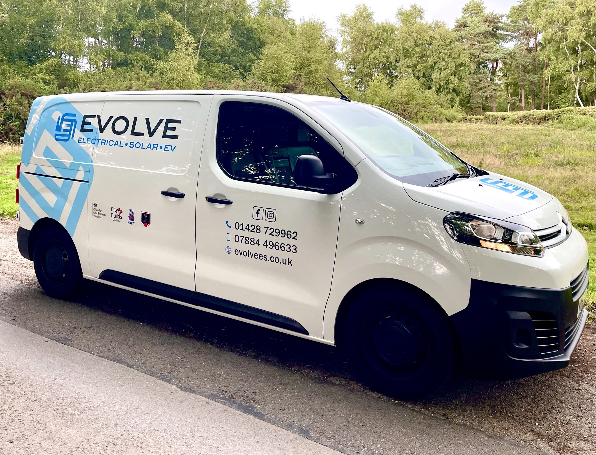 The white Evolve van with the blue Evolve livery, Electrical, Solar and EV