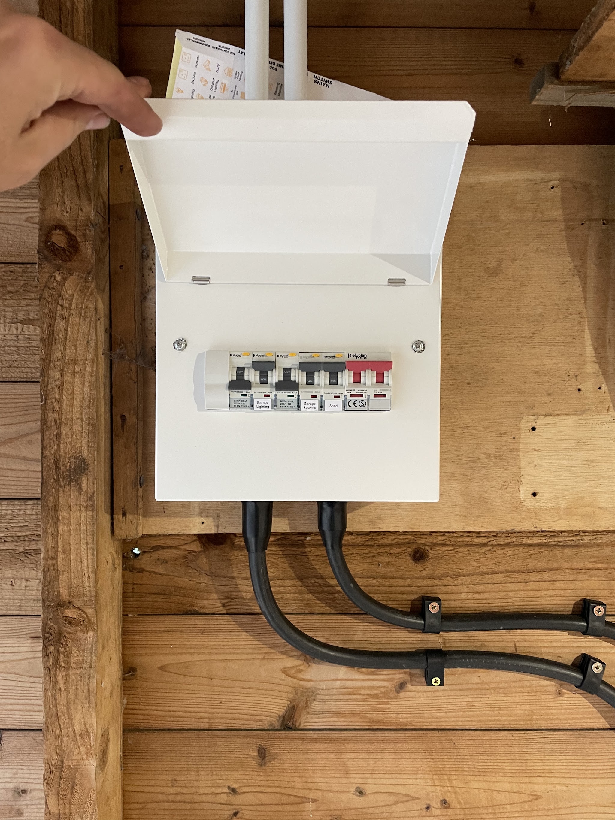 A new consumer unit fitted in a timber outbuilding